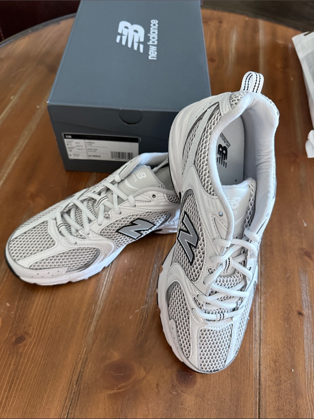 New Balance Men's Athletic Sneakers in White and Gray with Black Logo